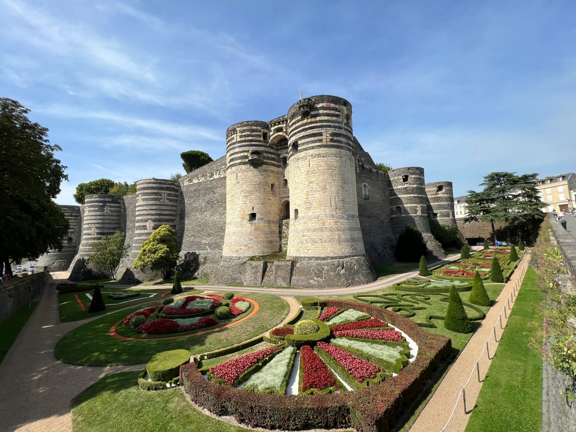 a castle with a garden in front